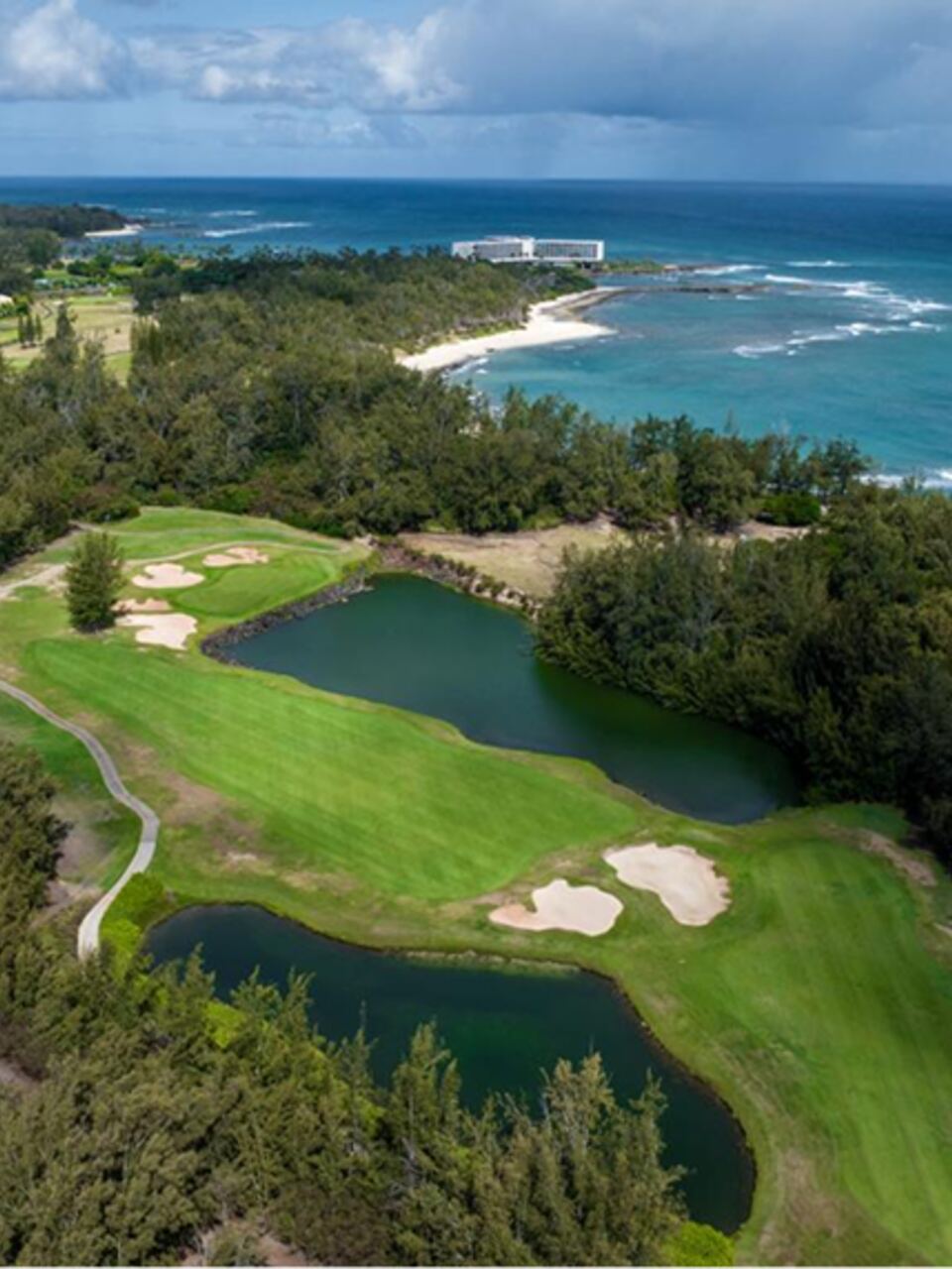 Oceanfront fairway with ponds and bunkers along the North Shore at Turtle Bay Resort in Kahuku, Hawaii